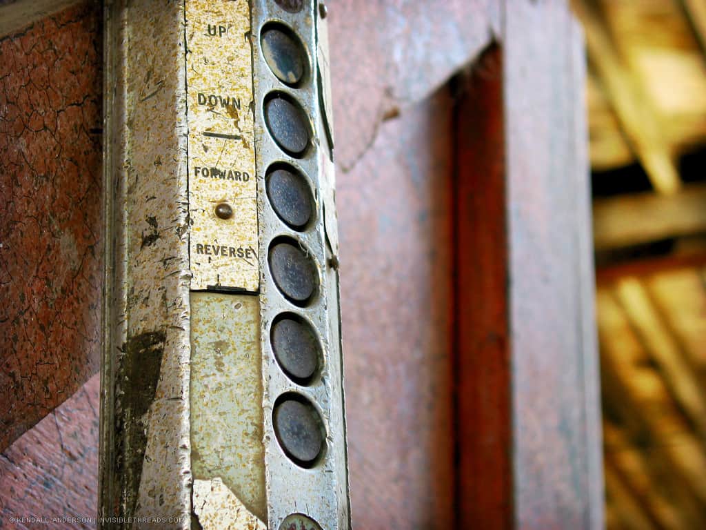 Industrial equipment control switch with buttons labelled Up, Down, Forward and Reverse